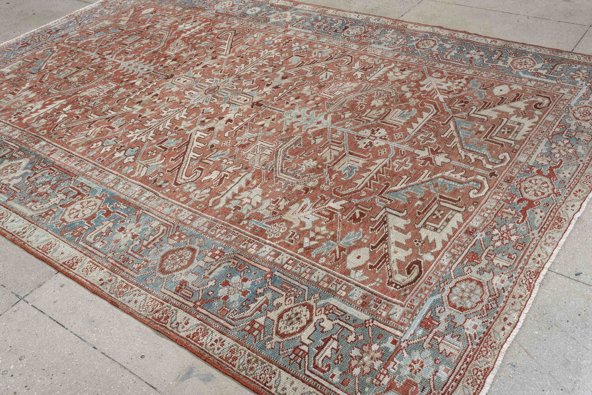 7' x 10' one-of-a-kind handmade antique Heriz large size rug. Color palette: terra cotta, ivory, blue gray, rust, pale blue