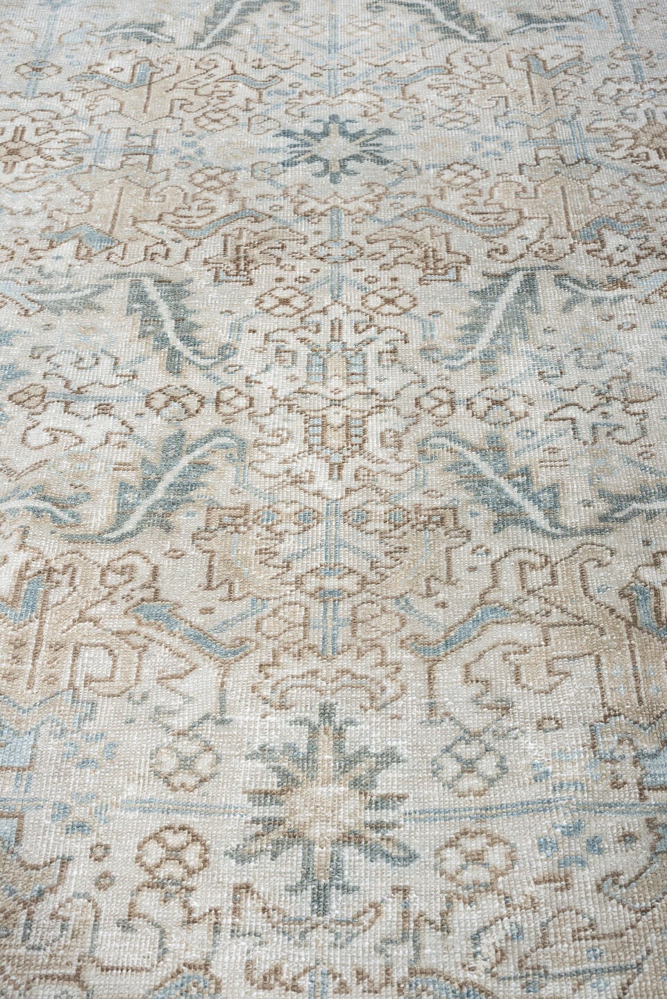 7' x 8' one-of-a-kind handmade antique Heriz rug. Color palette: ivory, pale blue, sage, taupe, blue gray, beige, charcoal