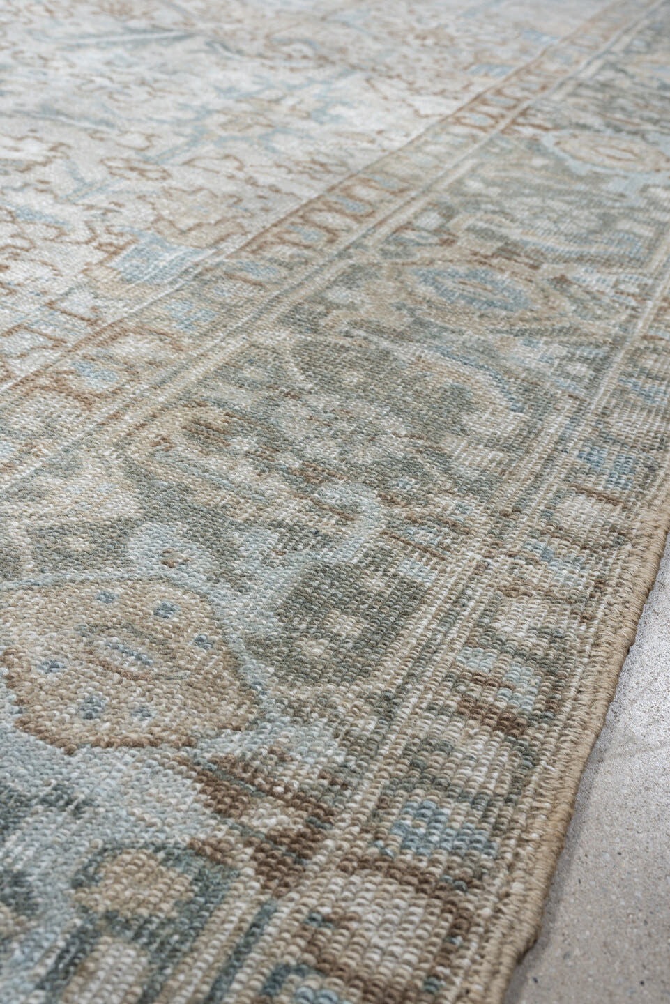 7' x 8' one-of-a-kind handmade antique Heriz rug. Color palette: ivory, pale blue, sage, taupe, blue gray, beige, charcoal