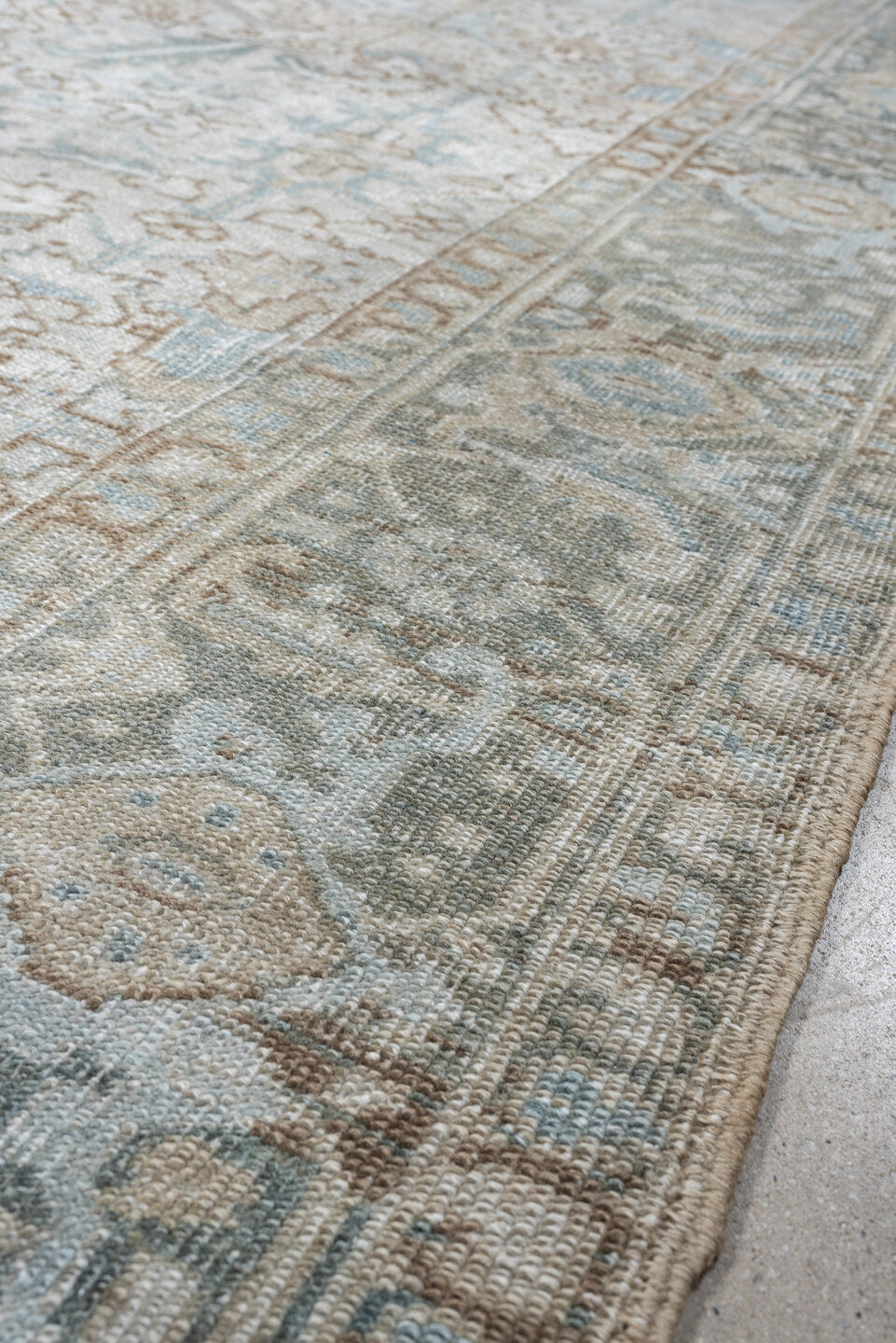 7' x 8' one-of-a-kind handmade antique Heriz rug. Color palette: ivory, pale blue, sage, taupe, blue gray, beige, charcoal