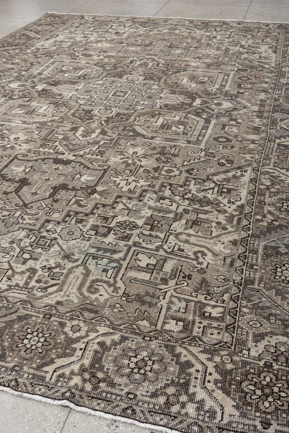 9' x 13' one-of-a-kind handmade antique Heriz large size rug. Color palette: taupe, ivory, charcoal, brown, slate, camel