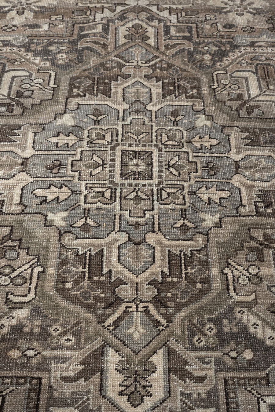 9' x 13' one-of-a-kind handmade antique Heriz large size rug. Color palette: taupe, ivory, charcoal, brown, slate, camel