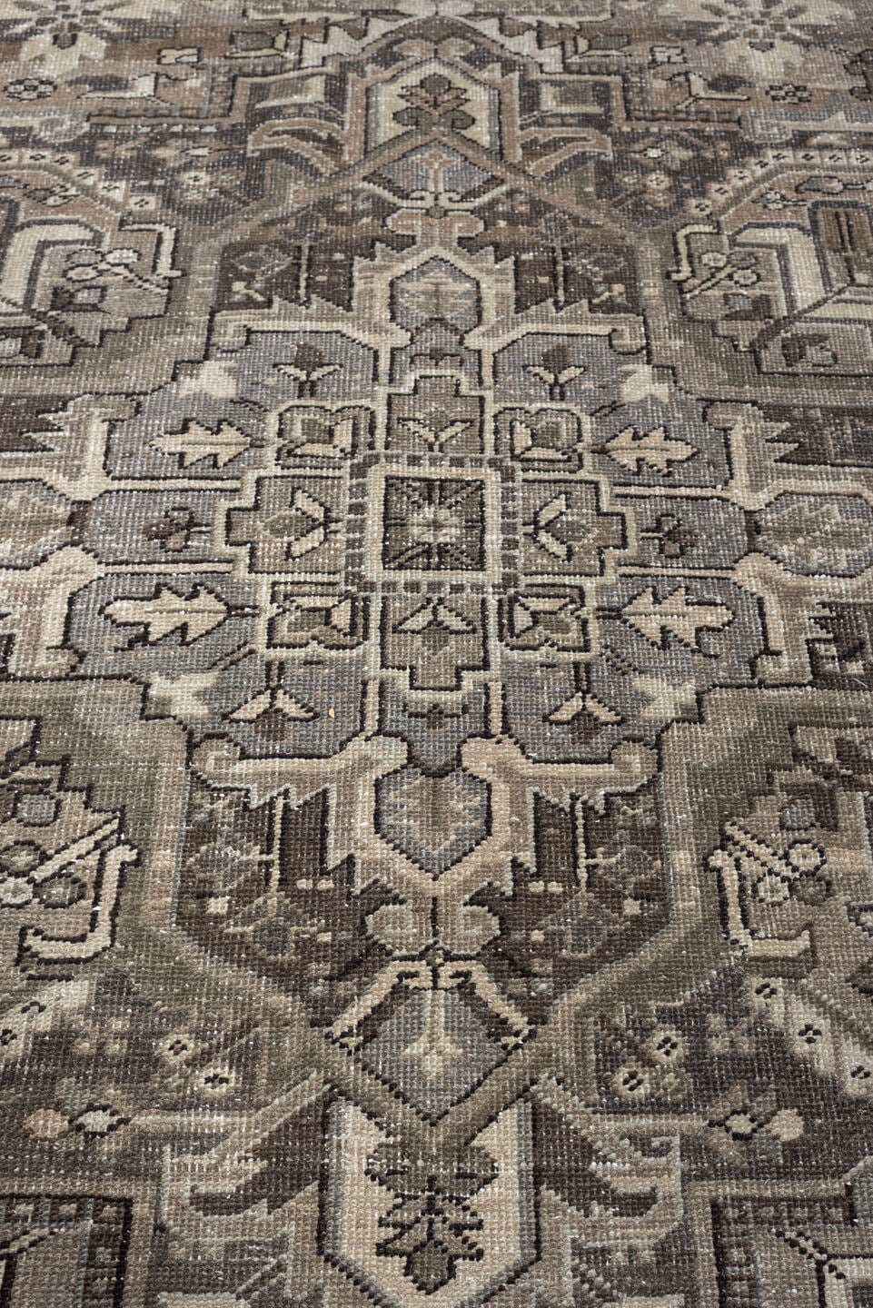 9' x 13' one-of-a-kind handmade antique Heriz large size rug. Color palette: taupe, ivory, charcoal, brown, slate, camel