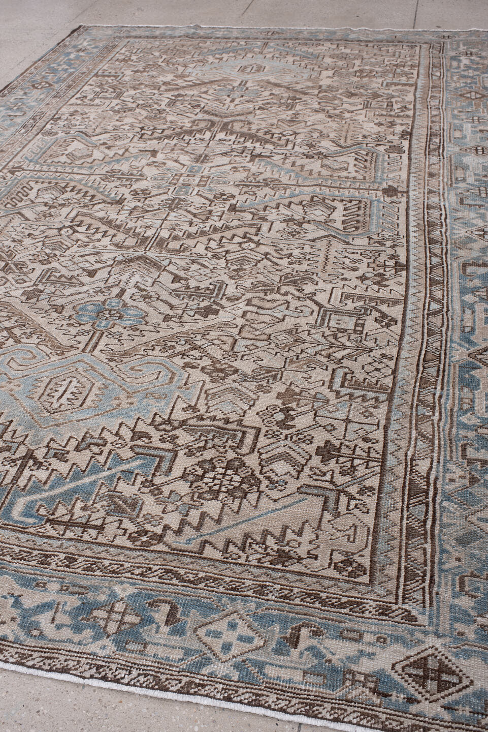 7' x 11' one-of-a-kind handmade antique Heriz large size rug. Color palette: ivory, blue gray, taupe, chocolate brown, slate