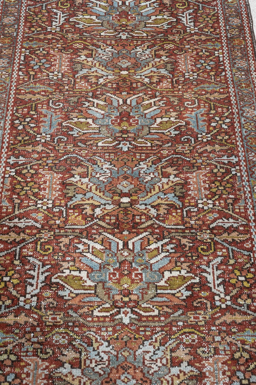7' x 10' one-of-a-kind handmade antique Heriz large size rug. Color palette: rust, powder blue, ivory, olive, rose, charcoal