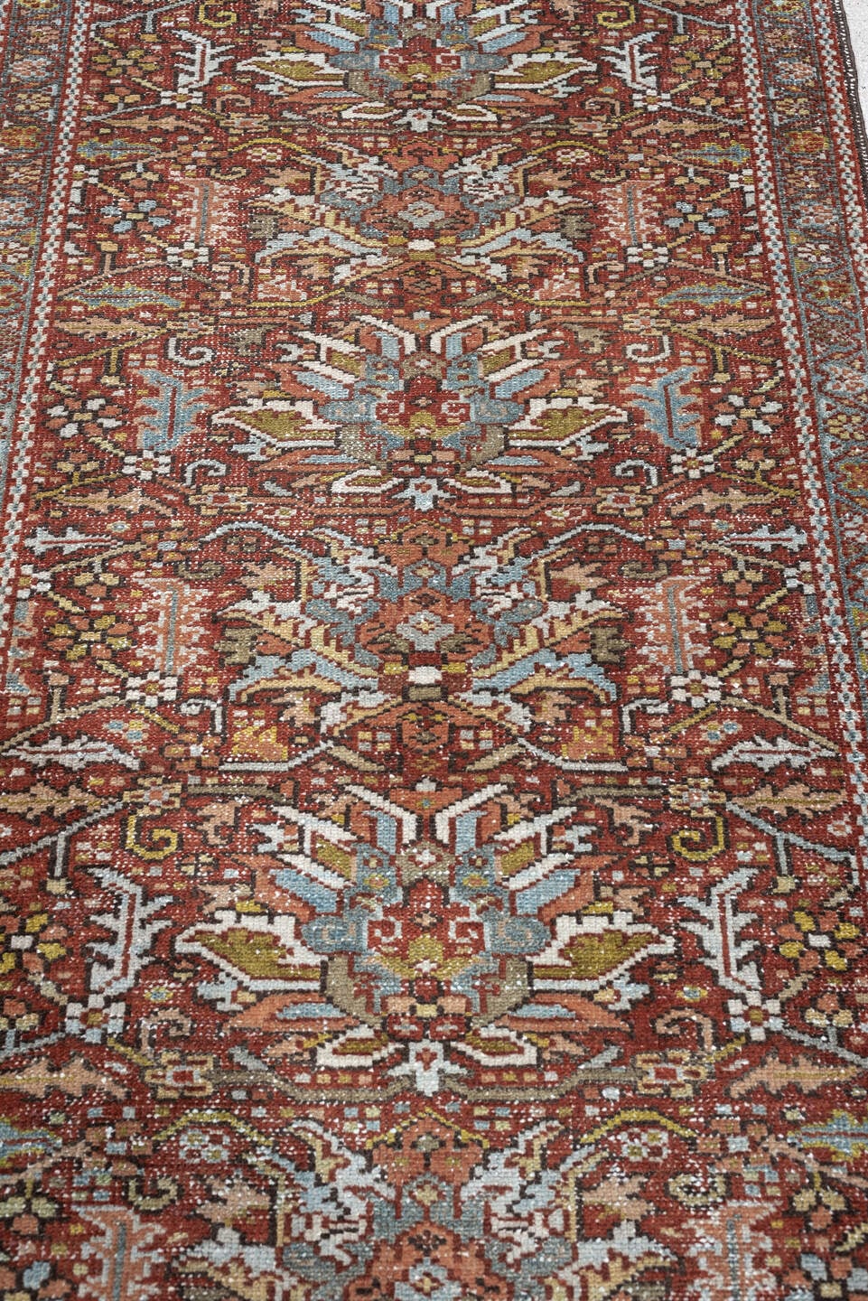 7' x 10' one-of-a-kind handmade antique Heriz large size rug. Color palette: rust, powder blue, ivory, olive, rose, charcoal