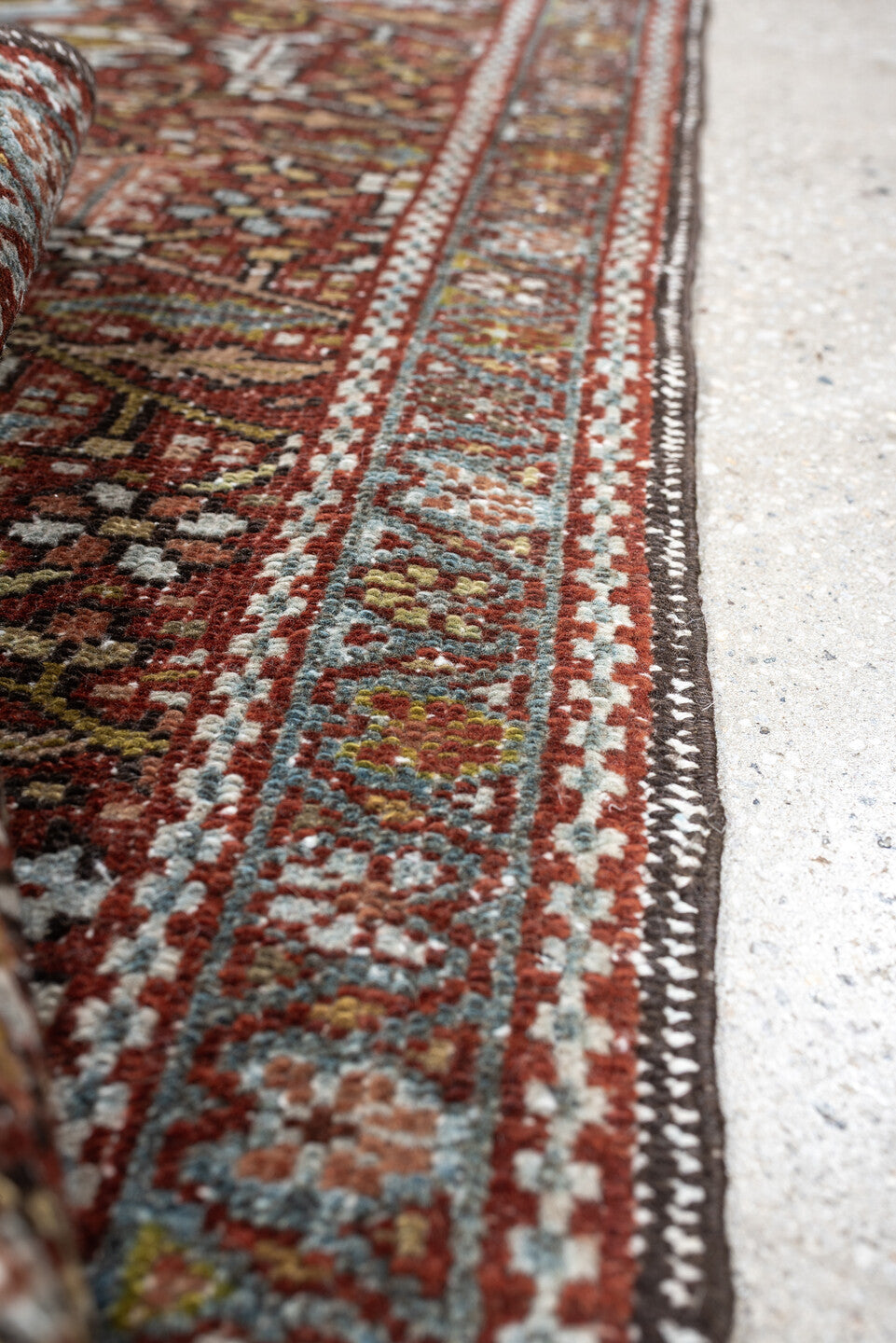 7' x 10' one-of-a-kind handmade antique Heriz large size rug. Color palette: rust, powder blue, ivory, olive, rose, charcoal