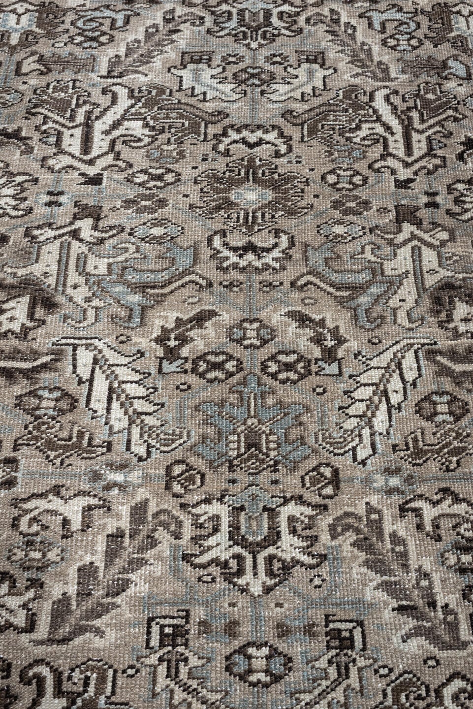 7' x 9' one-of-a-kind handmade antique Heriz large size rug. Color palette: ivory, taupe, charcoal, pale blue, gray, brown
