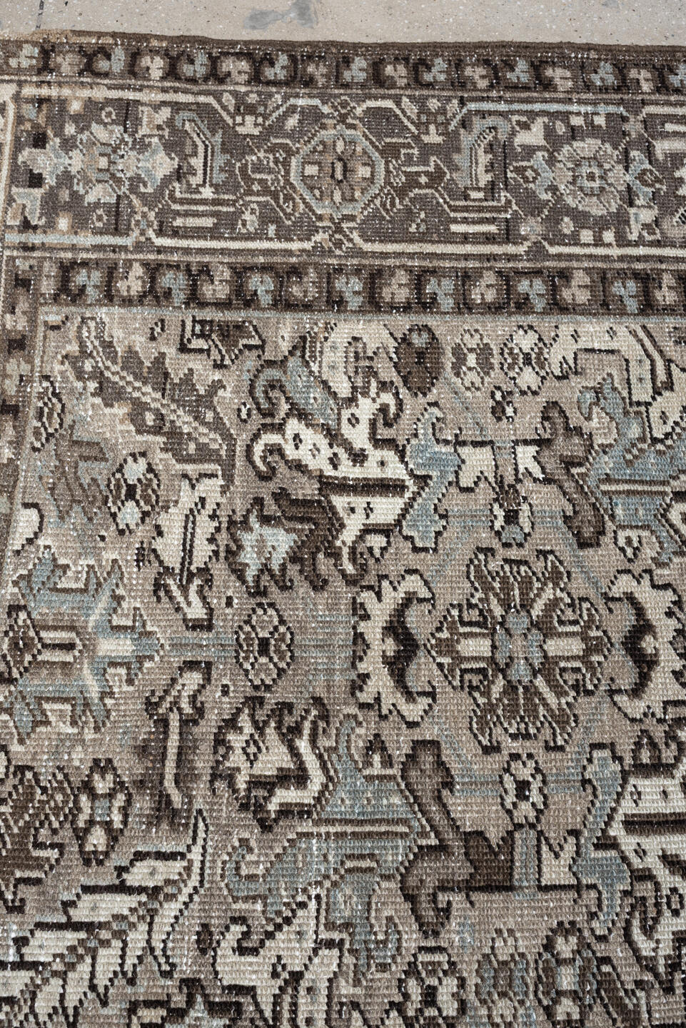 7' x 9' one-of-a-kind handmade antique Heriz large size rug. Color palette: ivory, taupe, charcoal, pale blue, gray, brown
