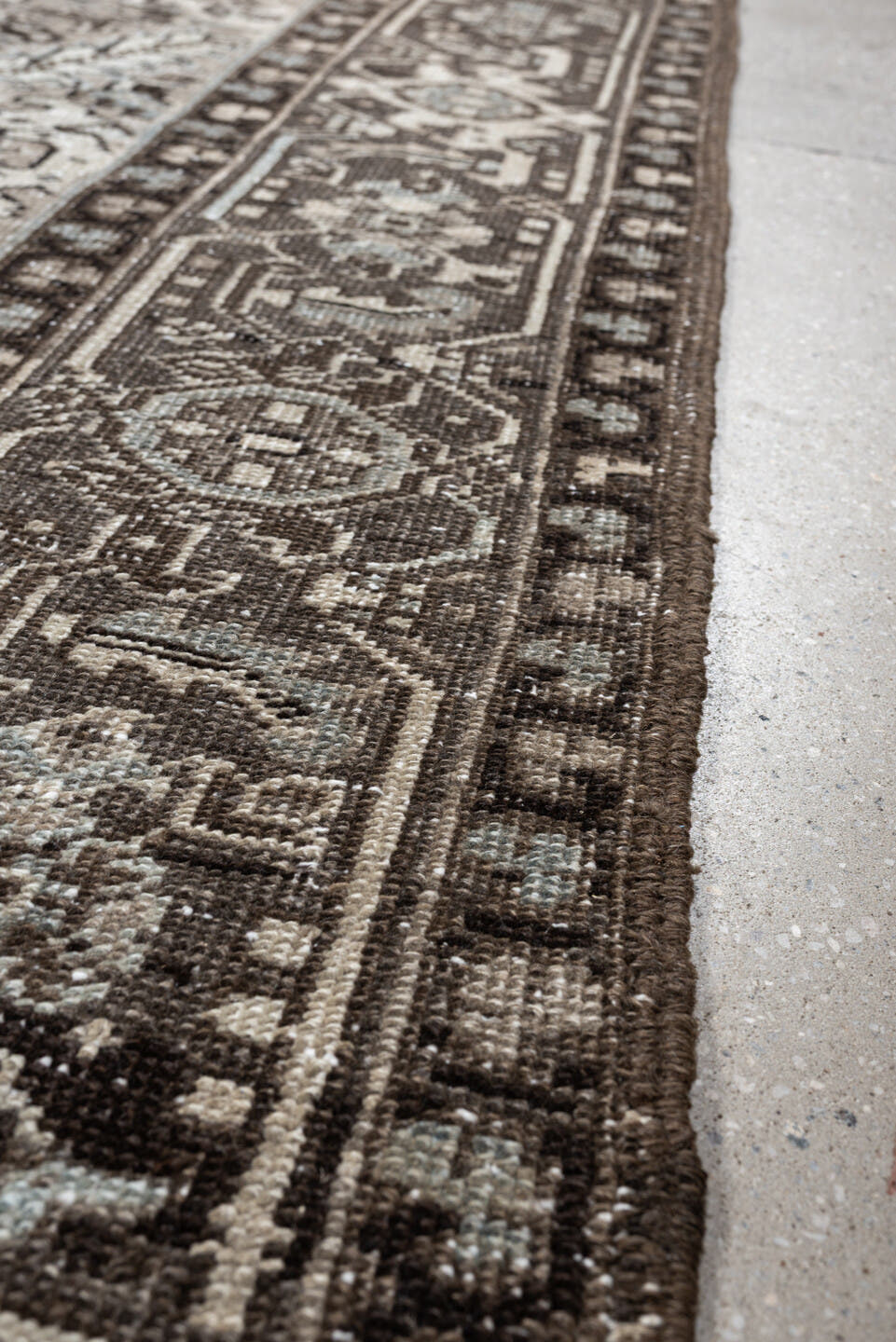 7' x 9' one-of-a-kind handmade antique Heriz large size rug. Color palette: ivory, taupe, charcoal, pale blue, gray, brown