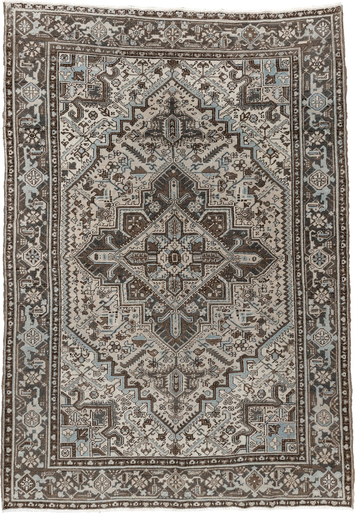 6' x 9' one-of-a-kind handmade antique Heriz medium size rug. Color palette: ivory, charcoal brown, pale blue, taupe, brown