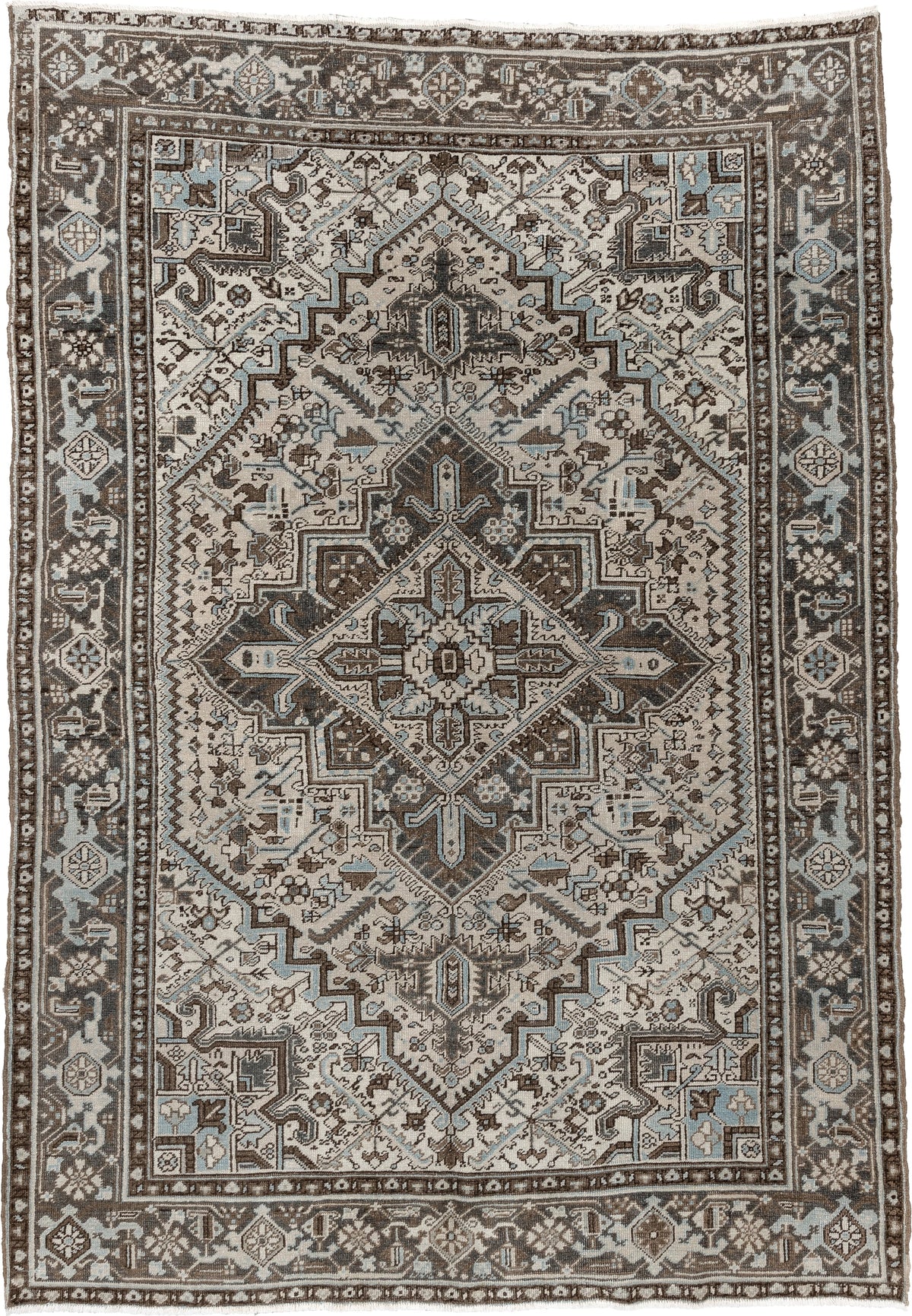 6' x 9' one-of-a-kind handmade antique Heriz medium size rug. Color palette: ivory, charcoal brown, pale blue, taupe, brown