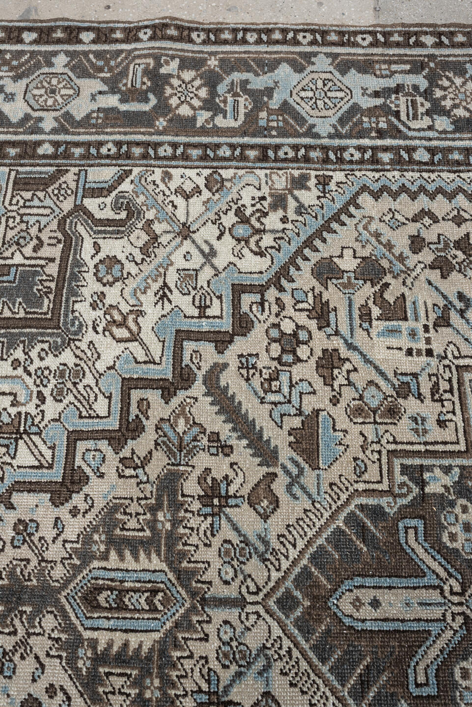 6' x 9' one-of-a-kind handmade antique Heriz medium size rug. Color palette: ivory, charcoal brown, pale blue, taupe, brown