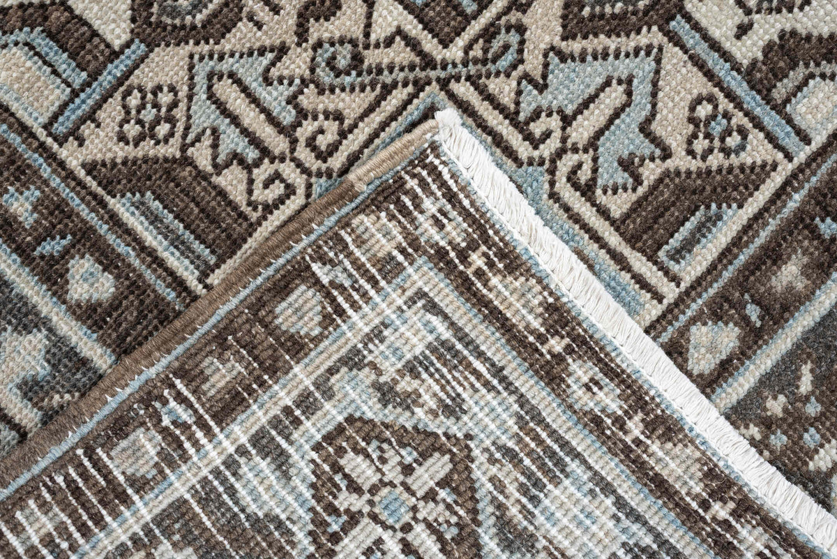 6' x 9' one-of-a-kind handmade antique Heriz medium size rug. Color palette: ivory, charcoal brown, pale blue, taupe, brown