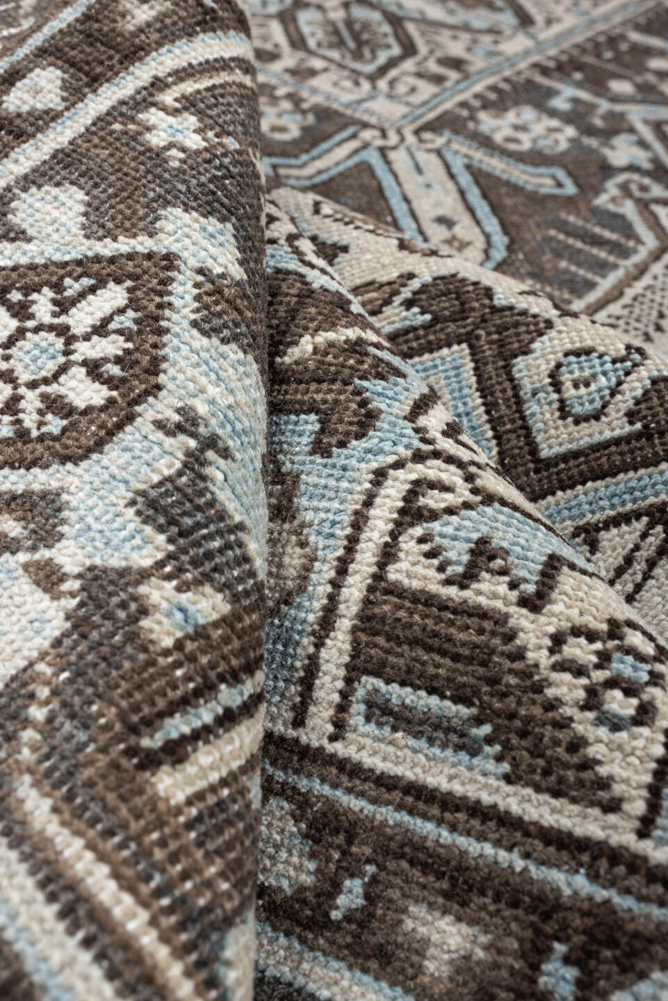 6' x 9' one-of-a-kind handmade antique Heriz medium size rug. Color palette: ivory, charcoal brown, pale blue, taupe, brown