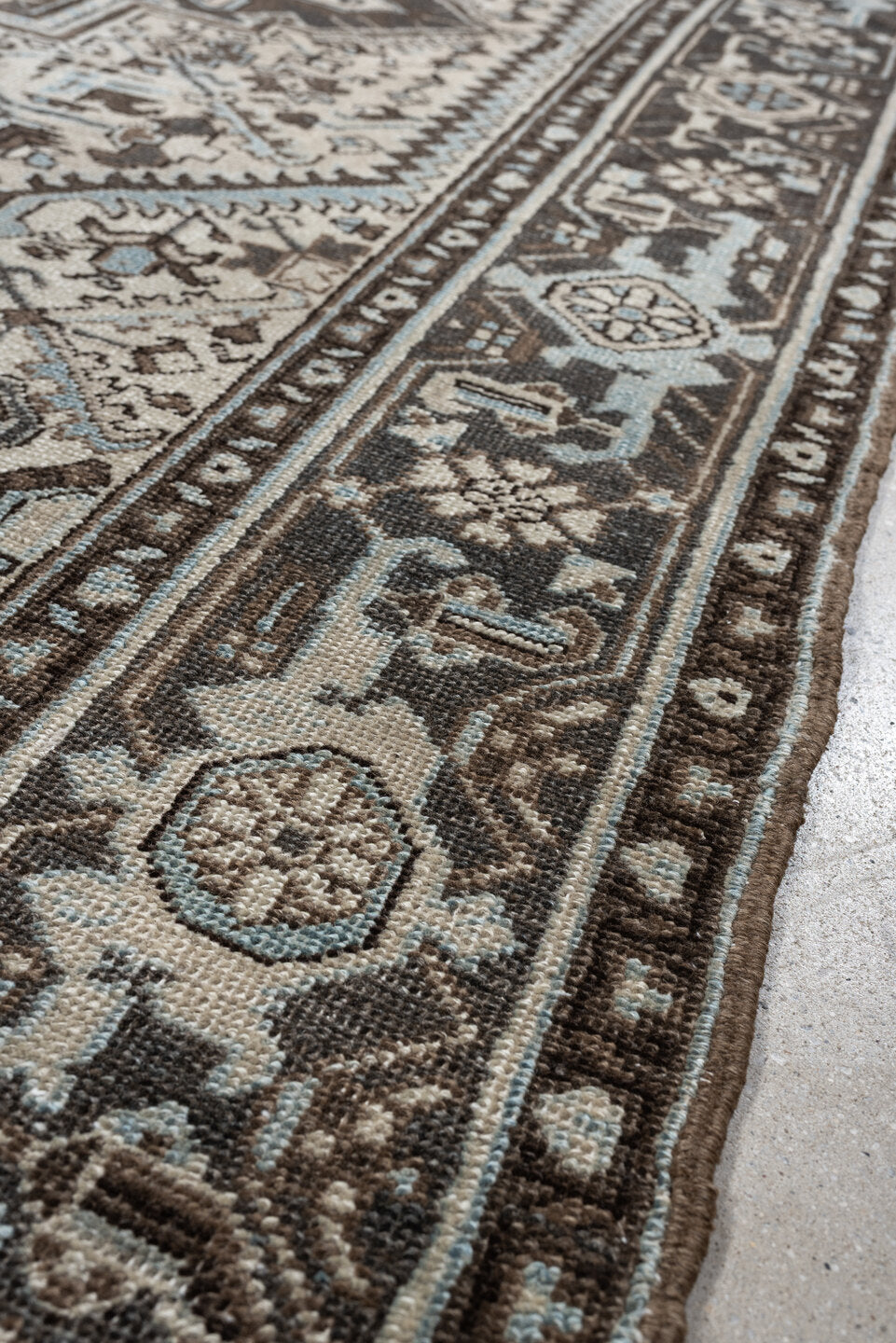 6' x 9' one-of-a-kind handmade antique Heriz medium size rug. Color palette: ivory, charcoal brown, pale blue, taupe, brown