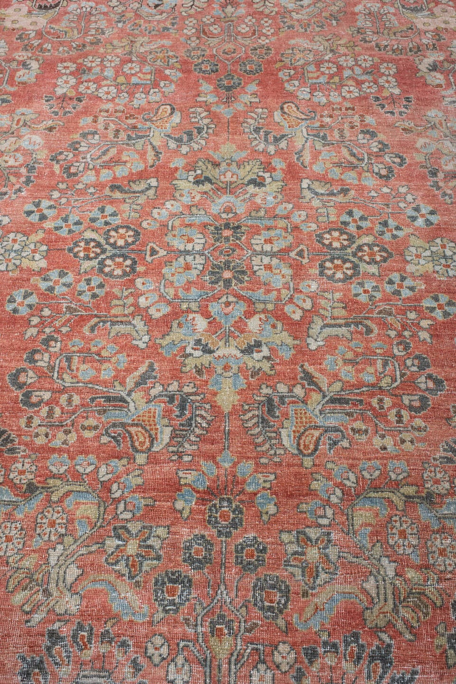 8' x 11' one-of-a-kind handmade antique Sarouk large size rug. Color palette: terracotta, powder blue, ivory, rust, charcoal