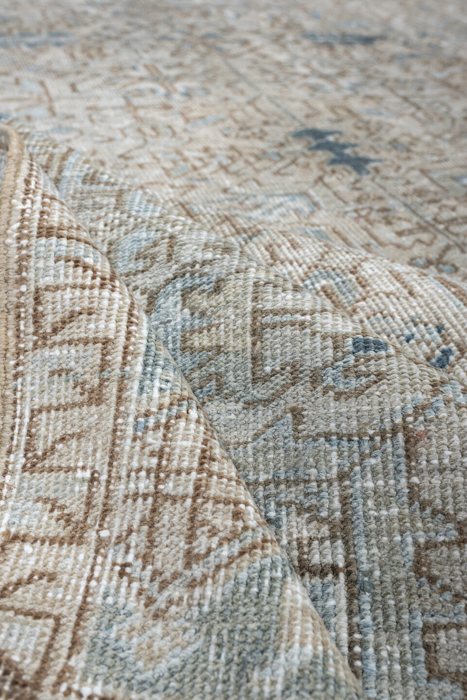 8' x 11' one-of-a-kind handmade antique Heriz large size rug. Color palette: ivory, slate blue, taupe, blue gray, camel