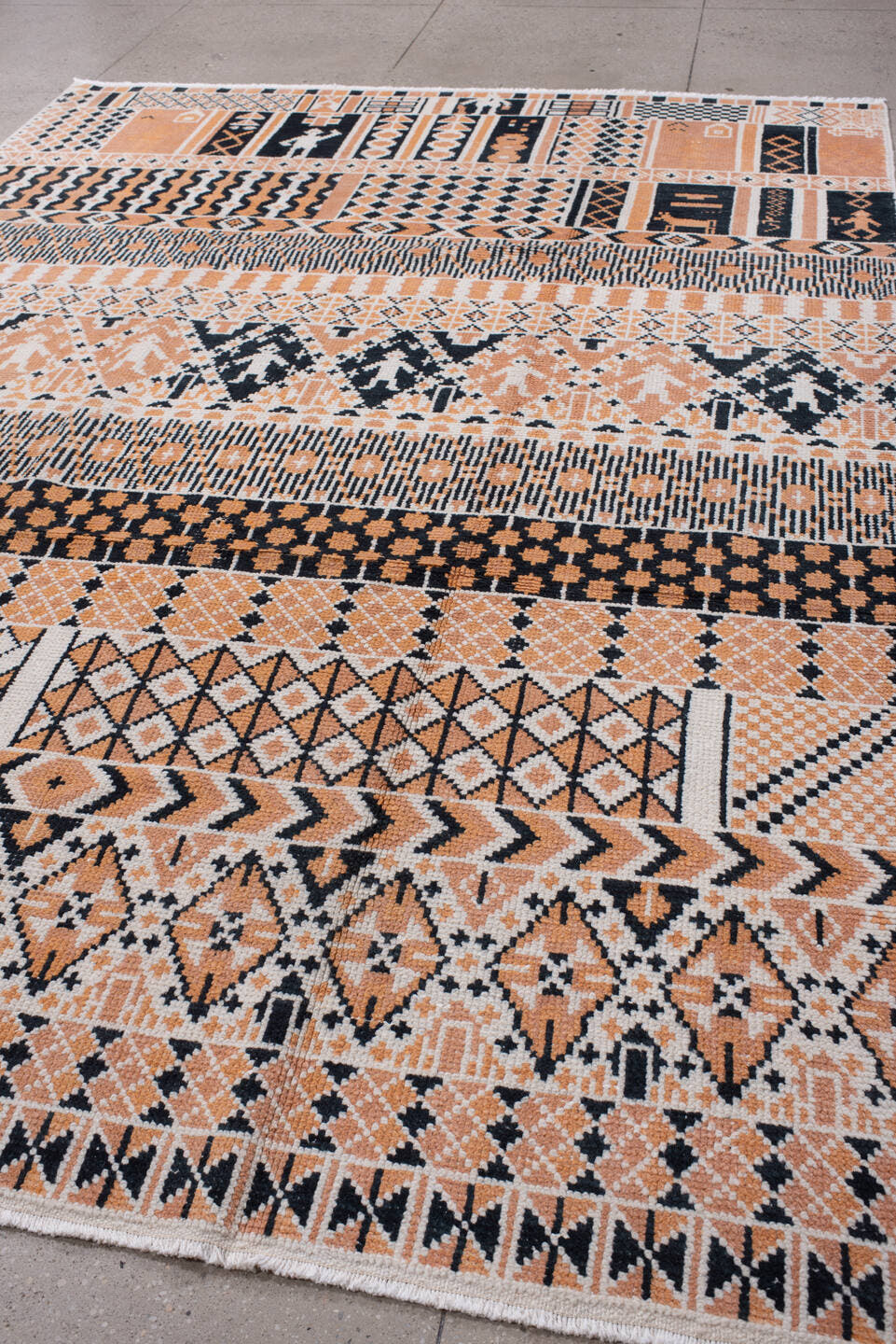 8' x 11' one-of-a-kind handmade antique Moroccan large size rug. Color palette: camel, ivory, ebony, charcoal, taupe, beige