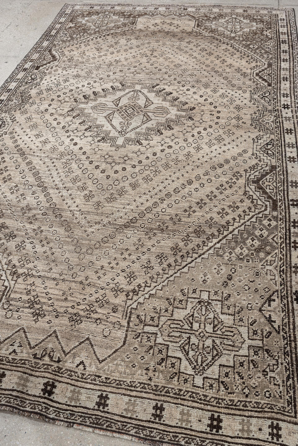 5' x 9' one-of-a-kind handmade antique Shiraz medium size rug. Color palette: ivory, taupe, charcoal, brown, camel, ebony