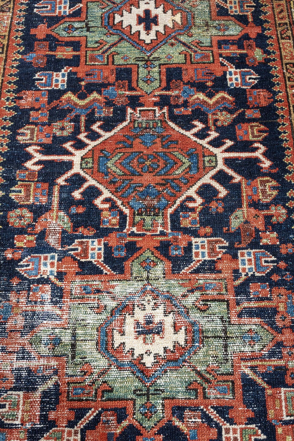 3' x 4' one-of-a-kind handmade antique Karaje small size rug. Color palette: navy, rust, ivory, terra cotta, blue, sage