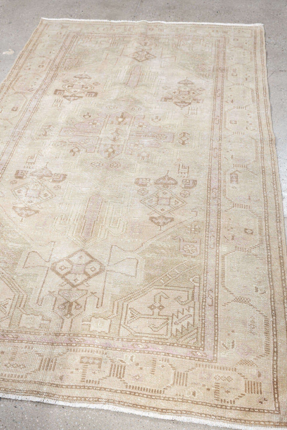 4' x 7' one-of-a-kind handmade antique rug. Color palette: ivory, cream, taupe, sand, sage, beige, pale brown, gray, green