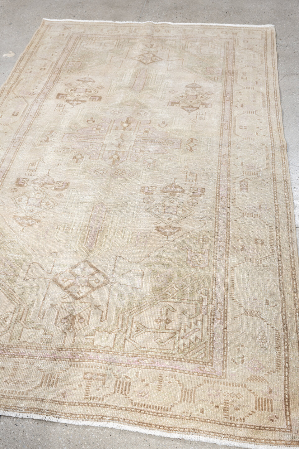 4' x 7' one-of-a-kind handmade antique rug. Color palette: ivory, cream, taupe, sand, sage, beige, pale brown, gray, green