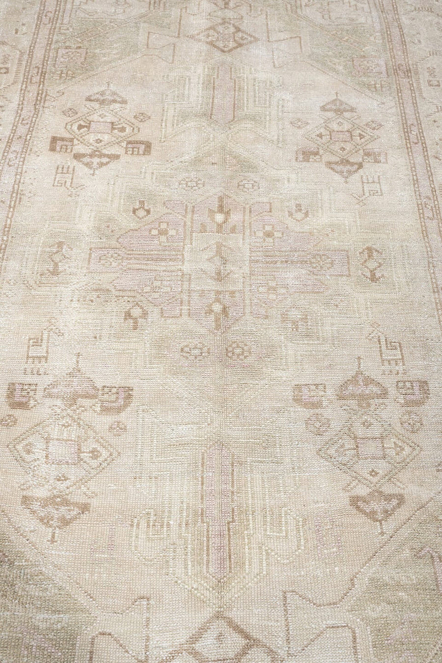 4' x 7' one-of-a-kind handmade antique rug. Color palette: ivory, cream, taupe, sand, sage, beige, pale brown, gray, green