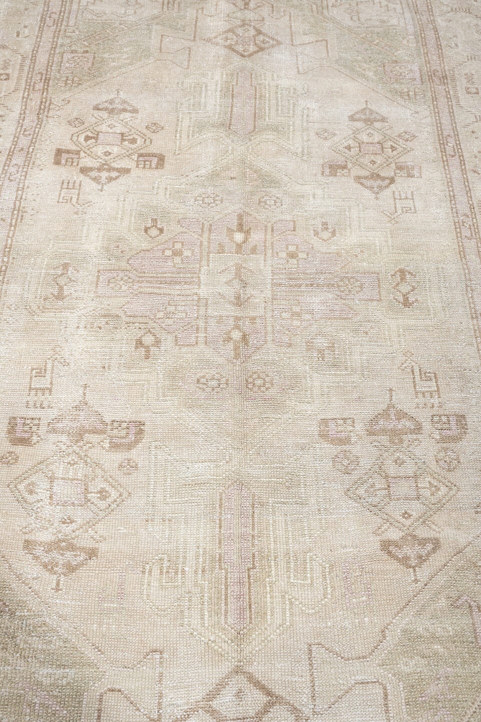4' x 7' one-of-a-kind handmade antique rug. Color palette: ivory, cream, taupe, sand, sage, beige, pale brown, gray, green