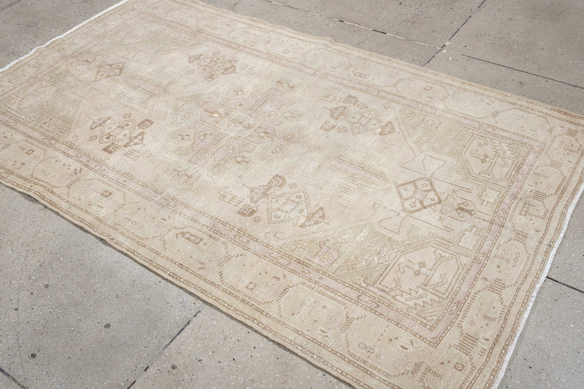 4' x 7' one-of-a-kind handmade antique rug. Color palette: ivory, cream, taupe, sand, sage, beige, pale brown, gray, green