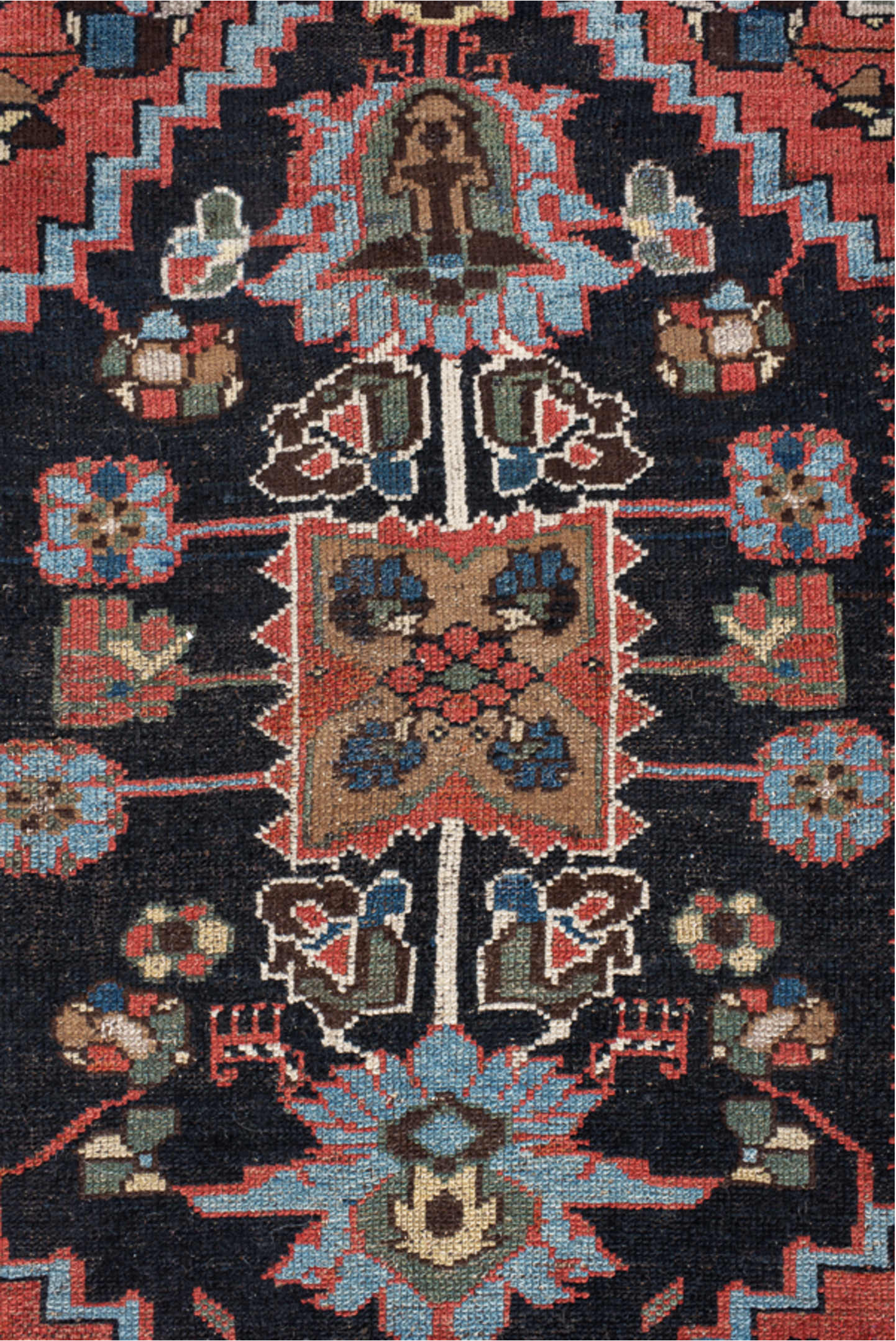 4' x 8' one-of-a-kind handmade vintage  rug. Color palette: navy, rust, ivory, sky blue, black, crimson, sage, camel, blue