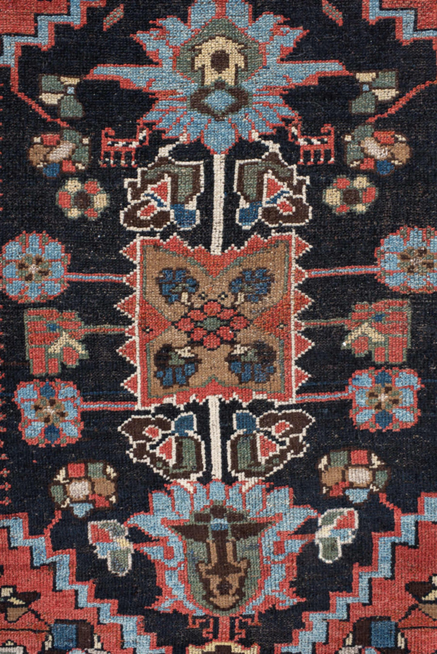 4' x 8' one-of-a-kind handmade vintage  rug. Color palette: navy, rust, ivory, sky blue, black, crimson, sage, camel, blue