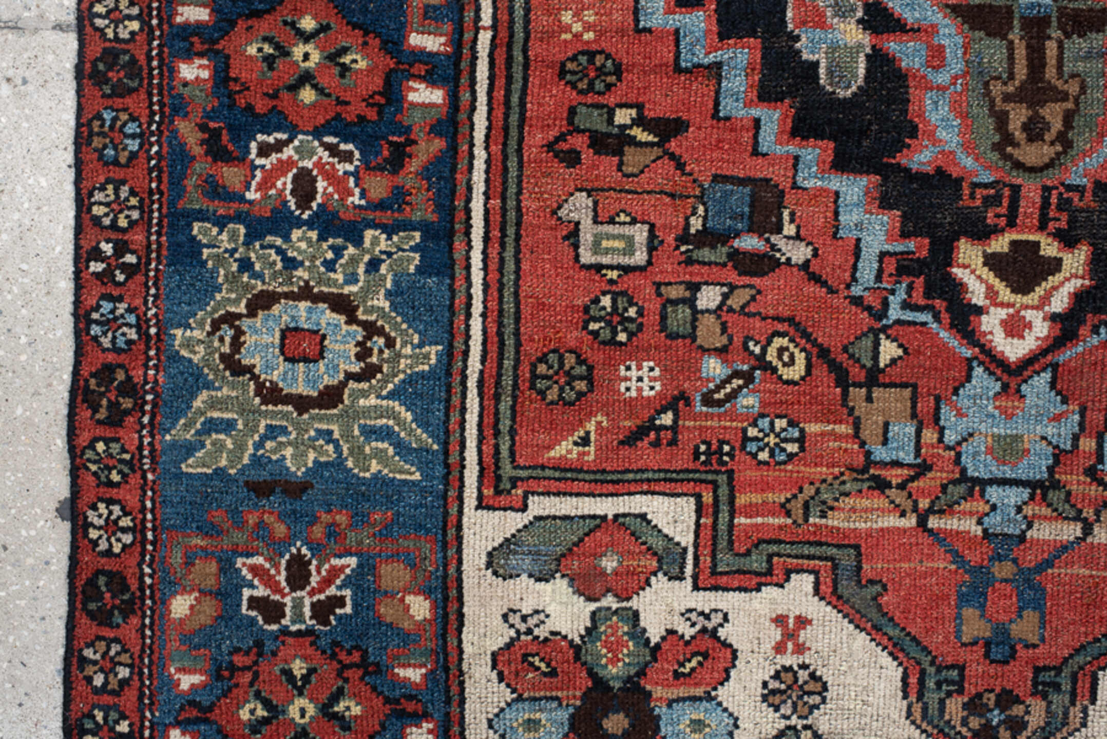 4' x 8' one-of-a-kind handmade vintage  rug. Color palette: navy, rust, ivory, sky blue, black, crimson, sage, camel, blue