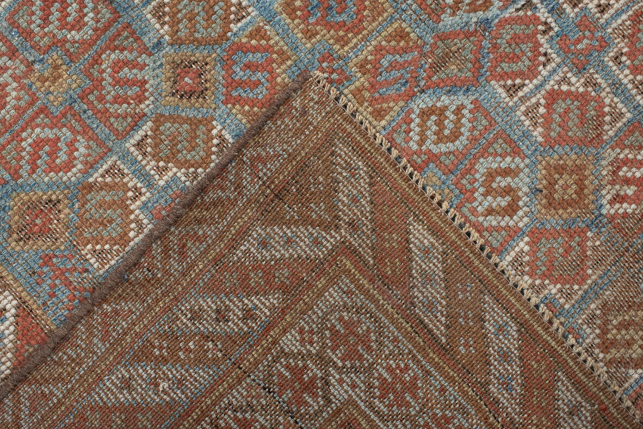4' x 7' one-of-a-kind handmade vintage Shiraz rug. Color palette: terra cotta, camel, blue, ivory, rust, taupe, terracotta