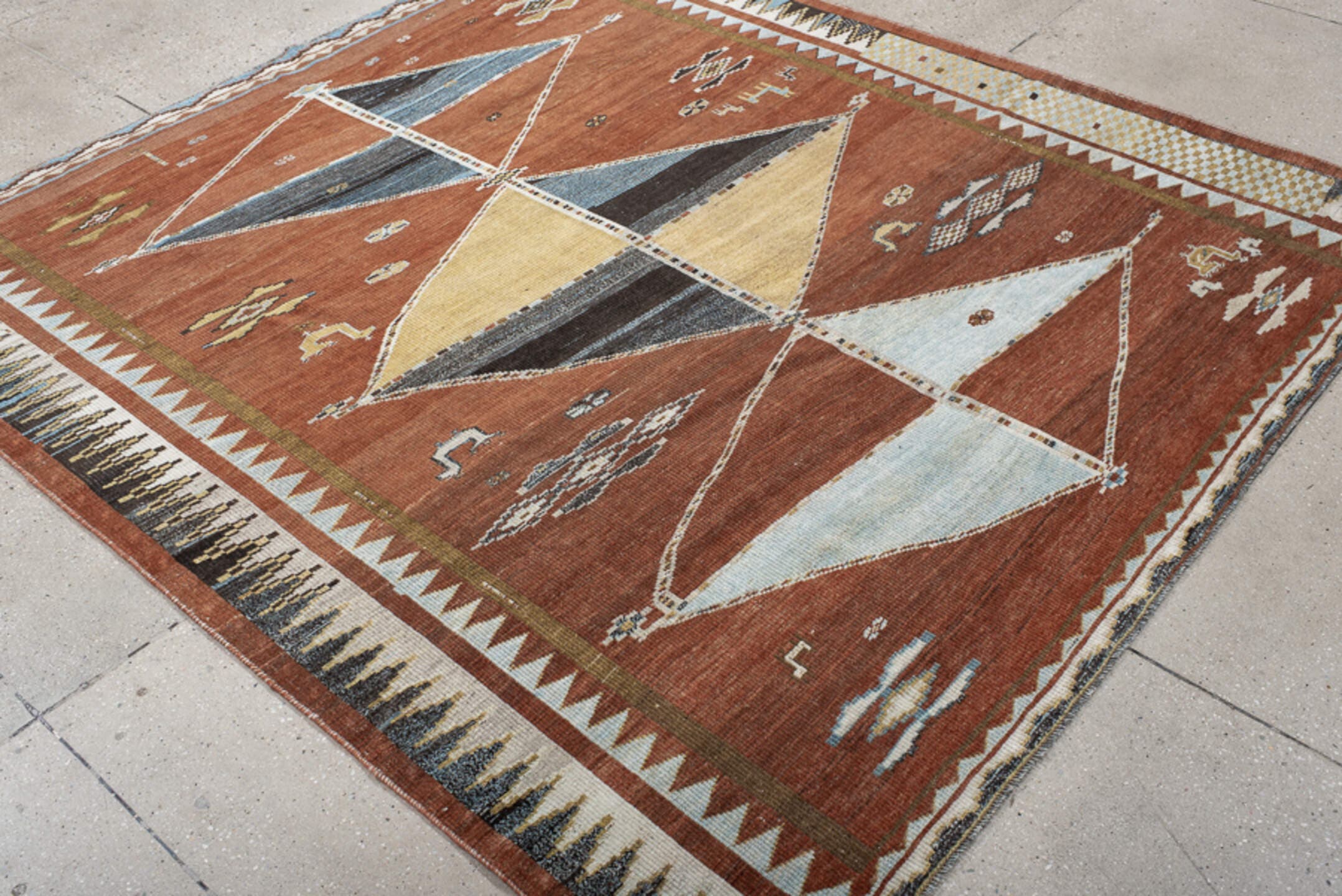 6' x 7' one-of-a-kind handmade vintage Gabbe rug. Color palette: rust, ivory, sky_blue, camel, charcoal, slate, olive