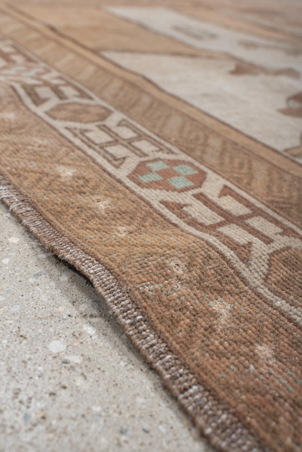 4' x 6' one-of-a-kind handmade vintage Belouch small size rug. Color palette: camel, taupe, brown, ivory, charcoal, rose