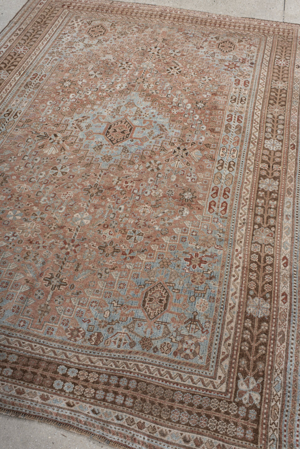 5' x 8' one-of-a-kind handmade vintage Shiraz medium size rug. Color palette: terra cotta, powder blue, ivory, brown, taupe