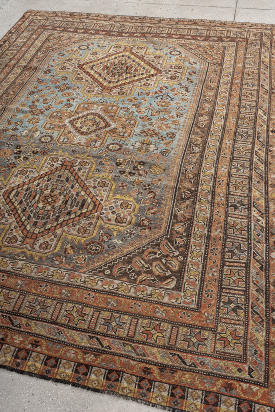 6' x 8' one-of-a-kind handmade vintage Shiraz medium size rug. Color palette: sky blue, rust, ivory, brown, camel, charcoal