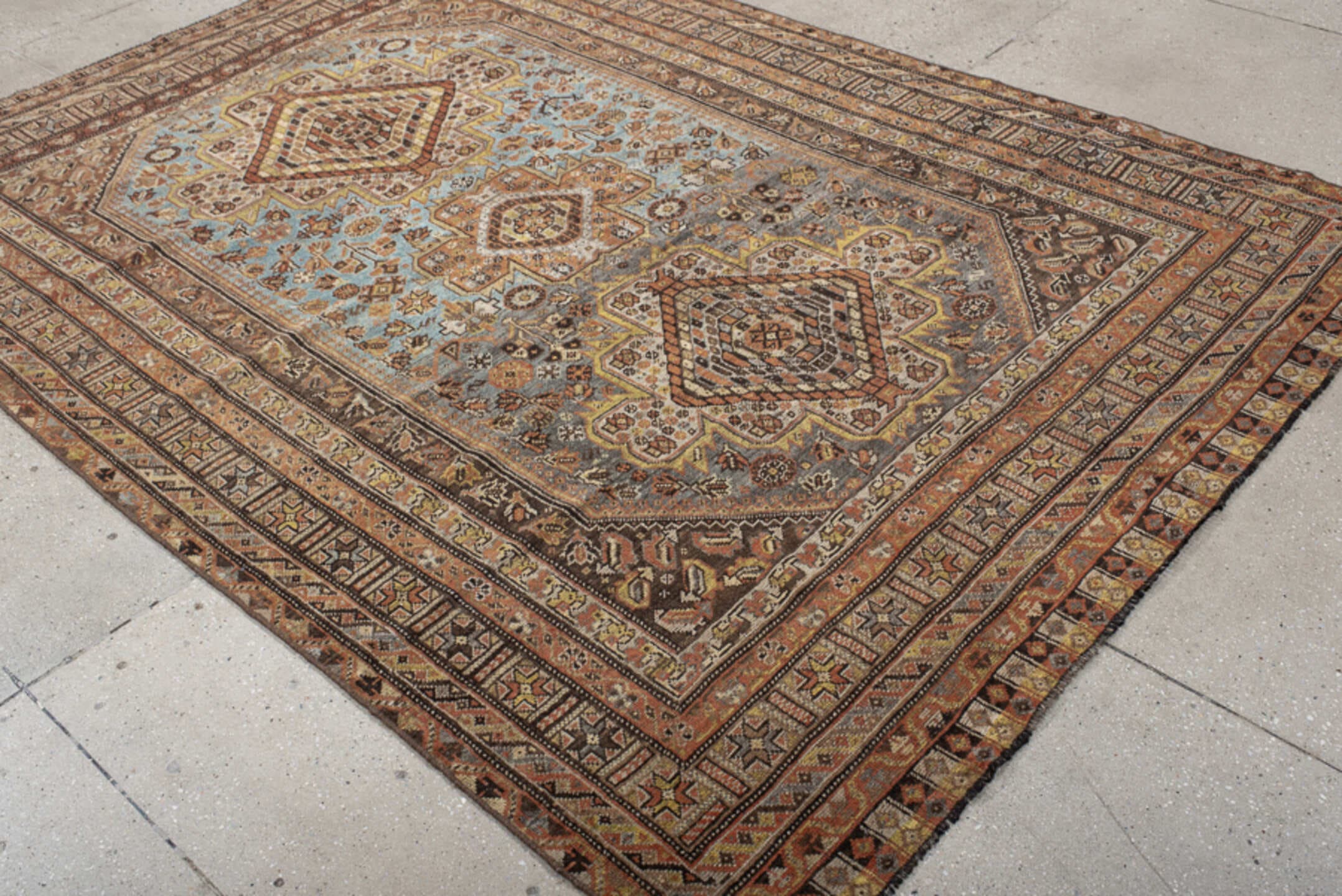6' x 8' one-of-a-kind handmade vintage Shiraz medium size rug. Color palette: sky blue, rust, ivory, brown, camel, charcoal