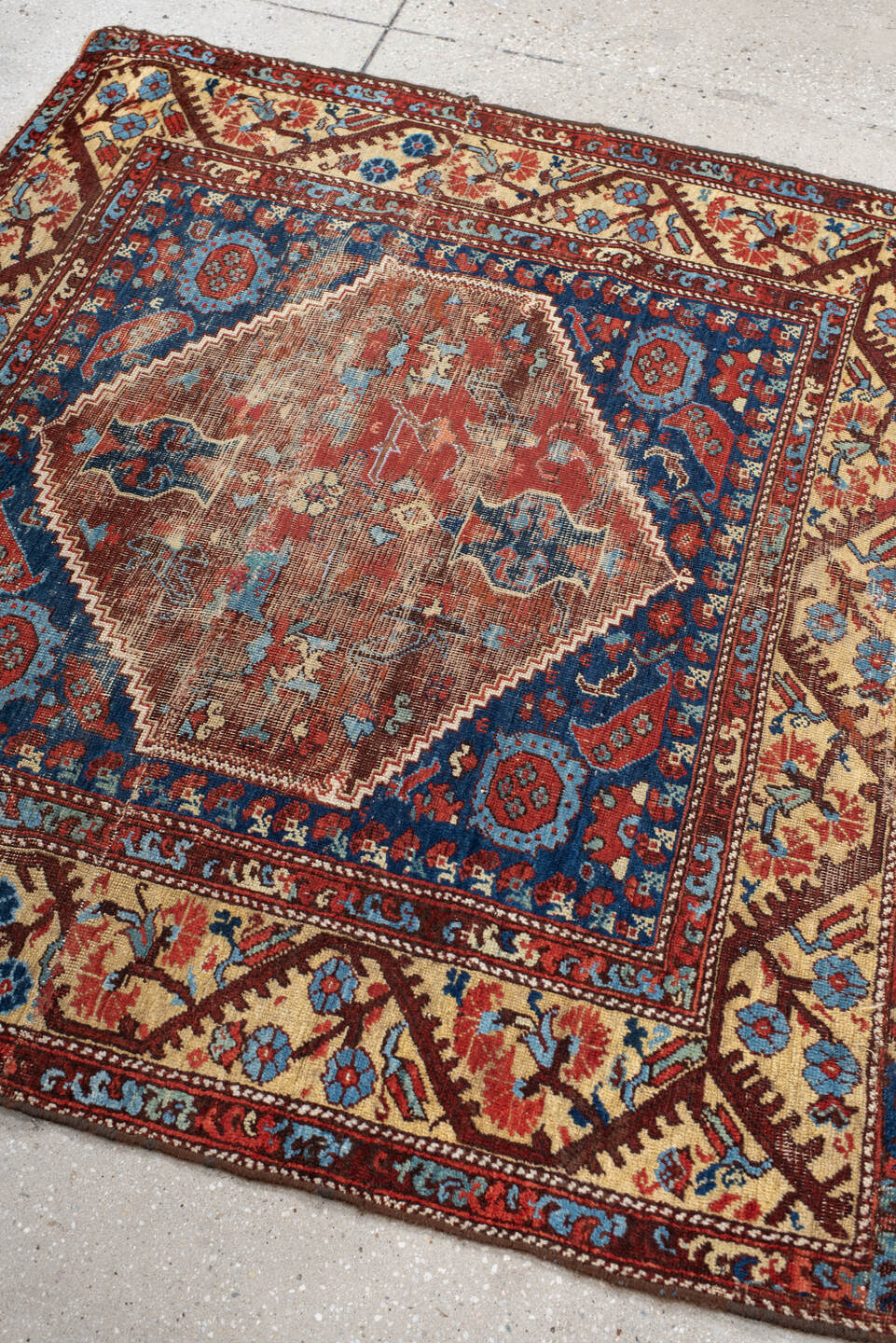 4' x 4' one-of-a-kind handmade antique Anatolian small size rug. Color palette: ivory, indigo, rust, sky_blue, brown