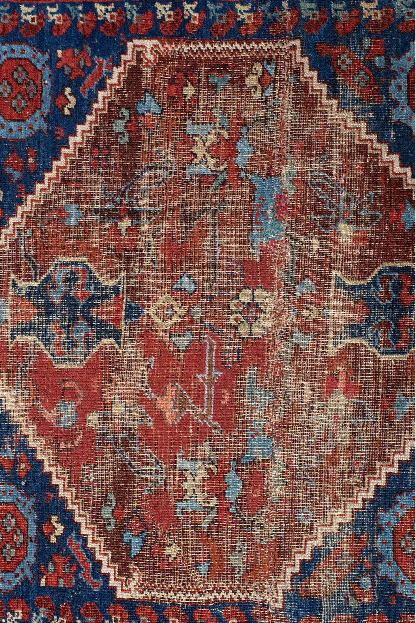 4' x 4' one-of-a-kind handmade vintage Anatolian small size rug. Color palette: blue, brown, gray, off-white, orange, pink