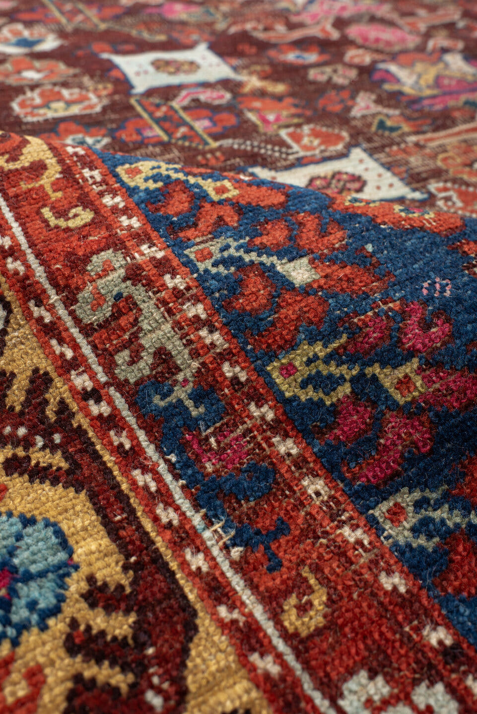 4' x 5' one-of-a-kind handmade vintage Anatolian small size rug. Color palette: rust, indigo, ivory, burgundy, sky blue