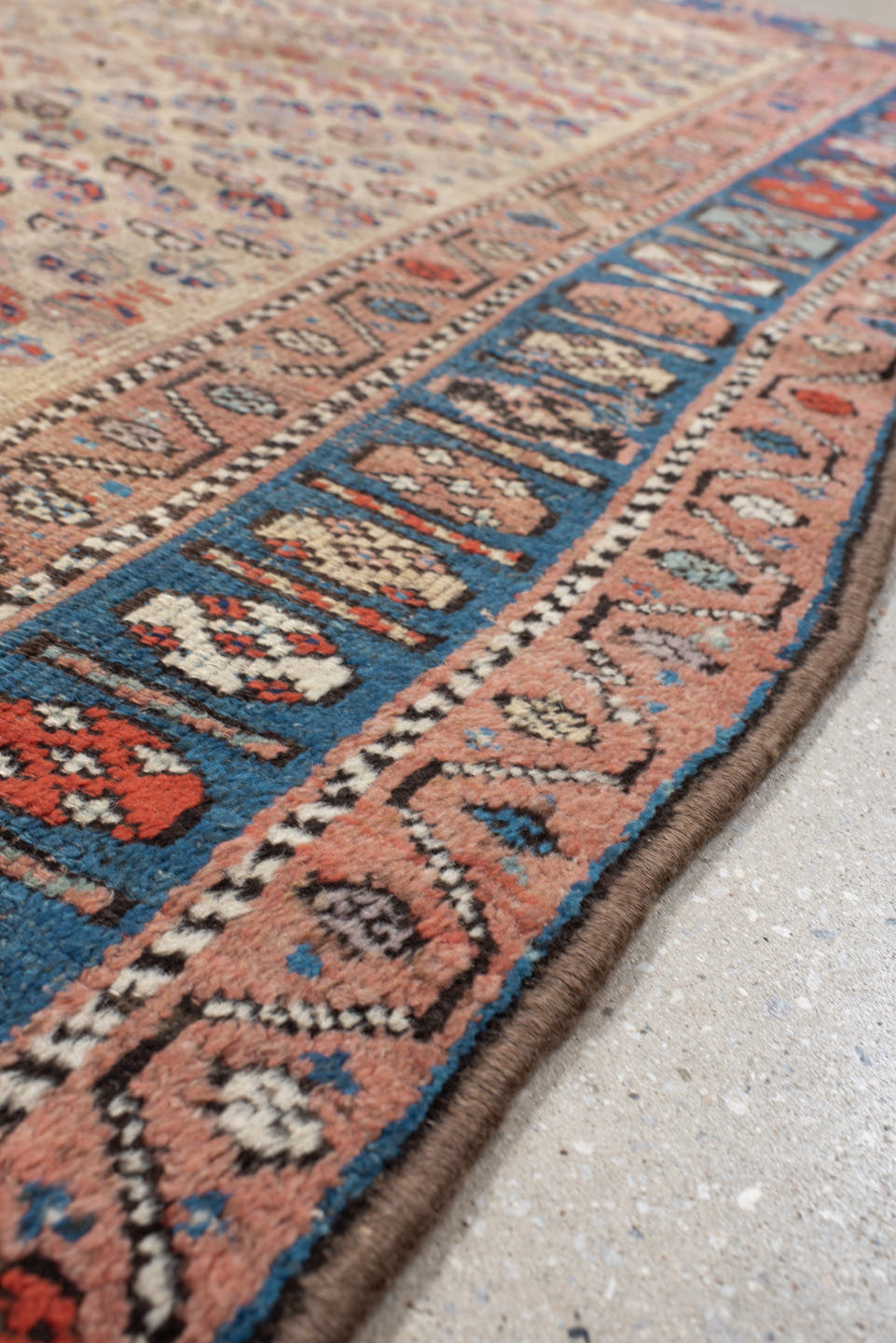 4' x 6' one-of-a-kind handmade vintage Kurd small size rug. Color palette: ivory, indigo, rose, rust, sky blue, charcoal