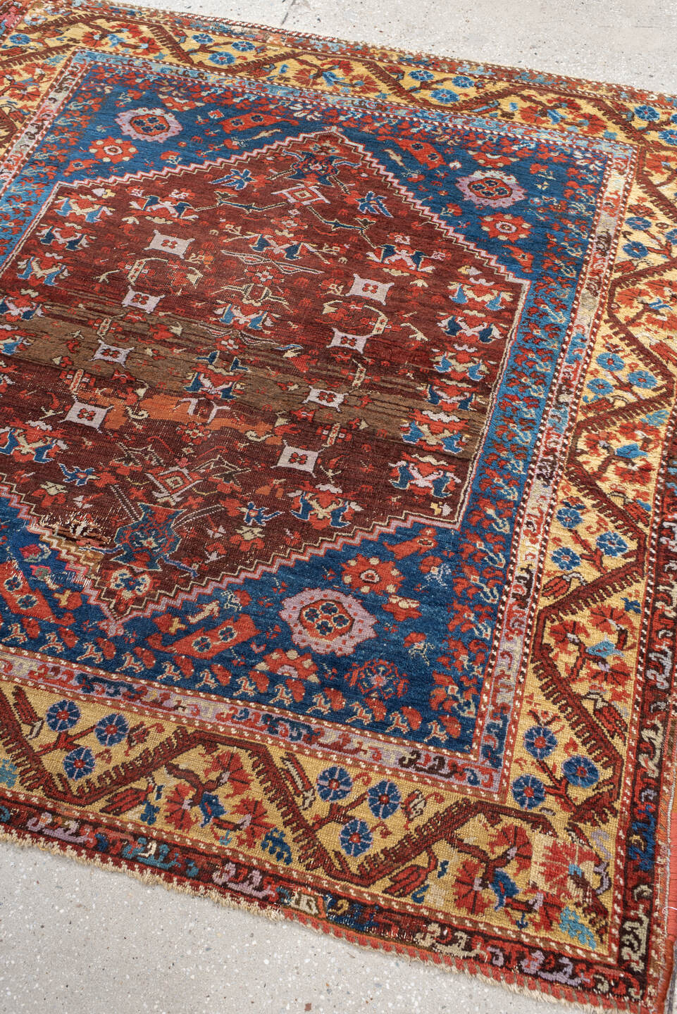 4' x 5' one-of-a-kind handmade vintage Anatolian small size rug. Color palette: blue, rust, ivory, terracotta, brown
