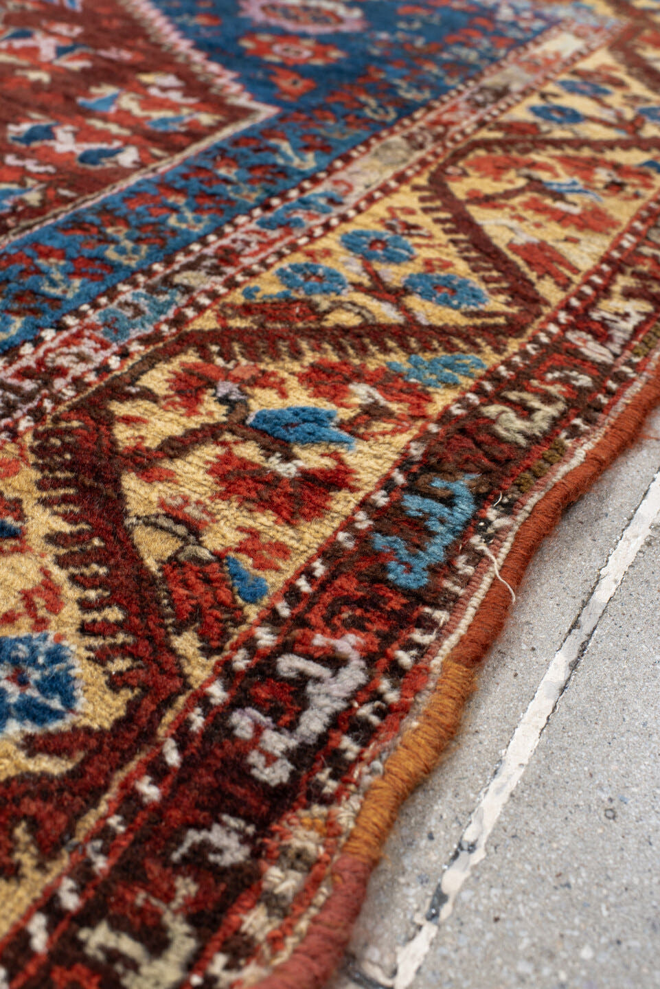 4' x 5' one-of-a-kind handmade vintage Anatolian small size rug. Color palette: blue, rust, ivory, terracotta, brown