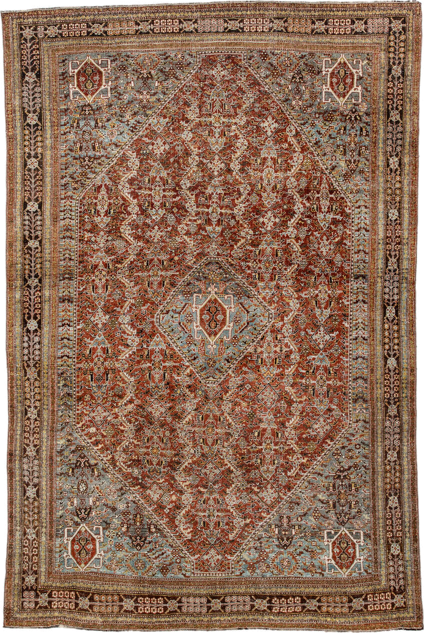 6' x 9' one-of-a-kind handmade vintage Qashqai medium size rug. Color palette: rust, light blue, ivory, brown, charcoal