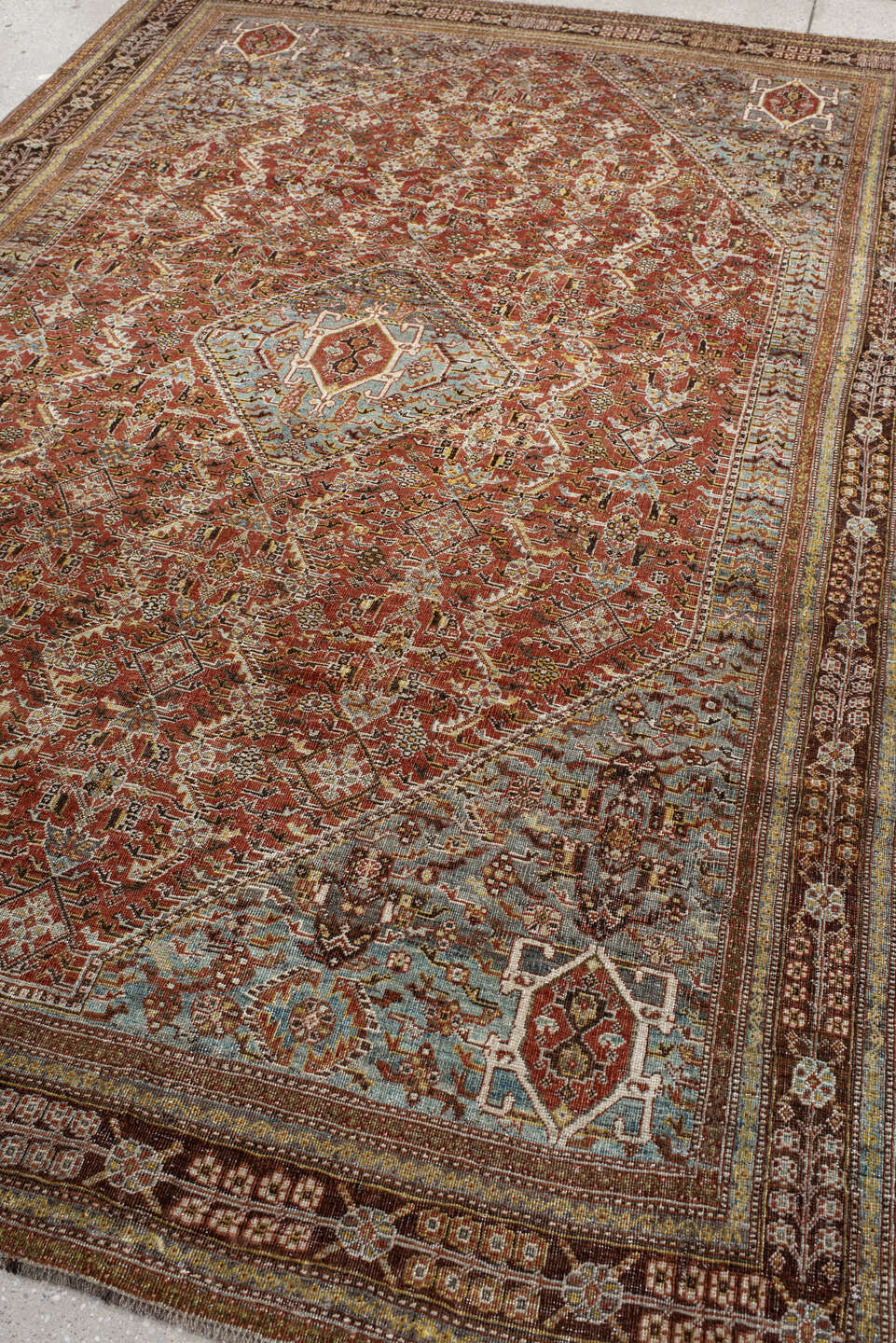 6' x 9' one-of-a-kind handmade vintage Qashqai medium size rug. Color palette: rust, light blue, ivory, brown, charcoal