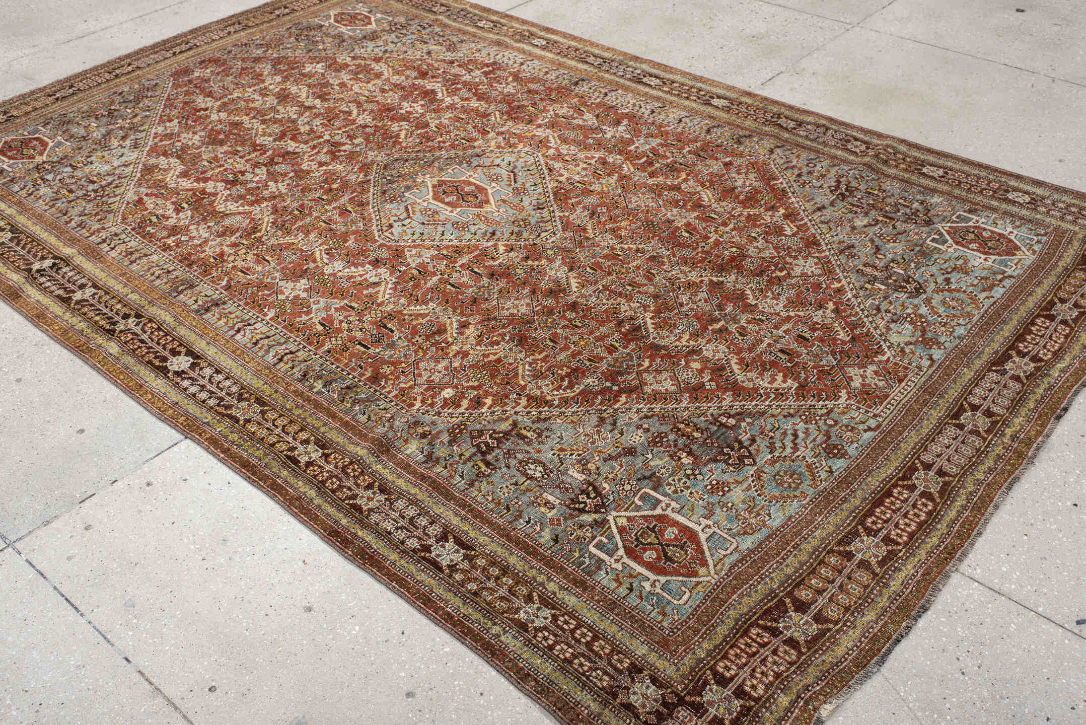 6' x 9' one-of-a-kind handmade vintage Qashqai medium size rug. Color palette: rust, light blue, ivory, brown, charcoal