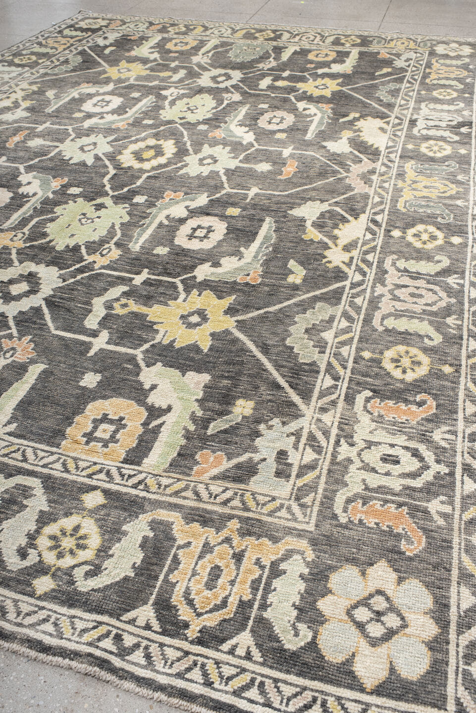 9' x 15' one-of-a-kind handmade vintage Oushak rug. Color palette: charcoal, ivory, sage, gold, peach, taupe, gray, black