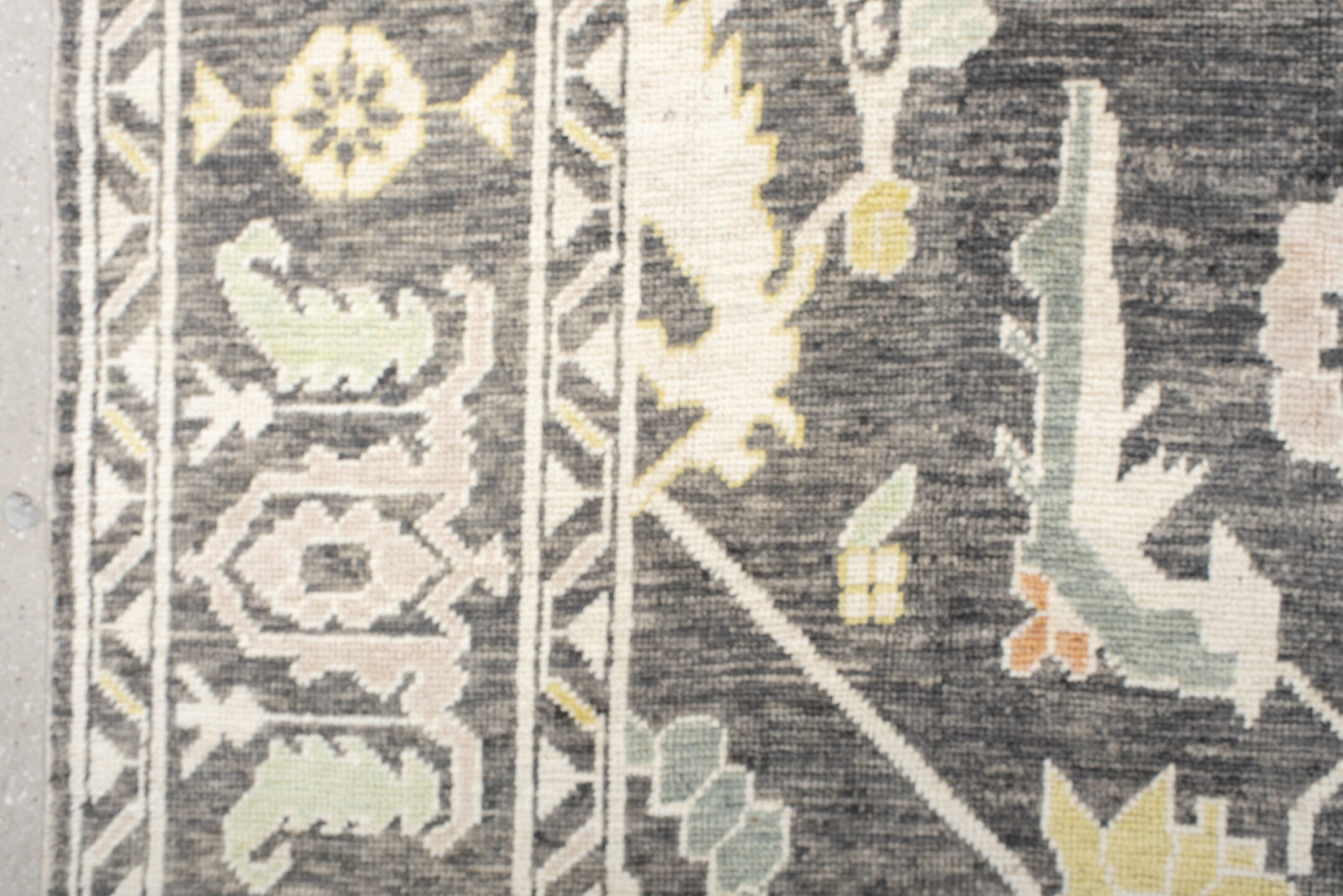 9' x 15' one-of-a-kind handmade vintage Oushak rug. Color palette: charcoal, ivory, sage, gold, peach, taupe, gray, black
